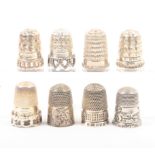 Eight English silver thimbles, five by Charles Horner and in mint condition (8)