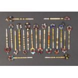 Twenty 19th Century bone lace bobbins all bound with brass wire mostly with coloured spots and