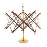 A Victorian exhibition quality swift or wool winder, the octagonal leaf scroll gilt brass base