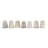 Seven English silver thimbles, all with Registered number and mostly mint condition (7)