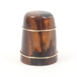 A 19th Century tortoiseshell thimble with two gilt metal bands below a cross hatched top
