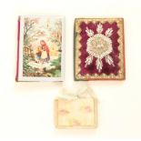 Three needlebooks, comprising a card example, the cover with rural winter scene “A Happy New