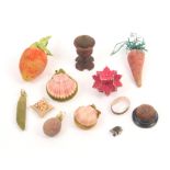 Twelve various pincushions, including four as fruit or vegetables, two from seashells, a pin stuck