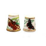 Two 19th Century English porcelain thimbles, one painted with a butterfly and leafy branch between