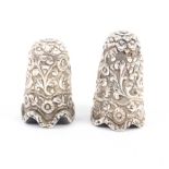 Two Indian Kutch silver thimbles, the first of tall form, both with undulating rims (2) First J.