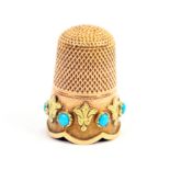 A 19th Century gold thimble, probably French, the frosted frieze with six turquoise coloured