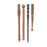 Four 19th Century spindle form knitting sticks two with turned decoration, two with carved