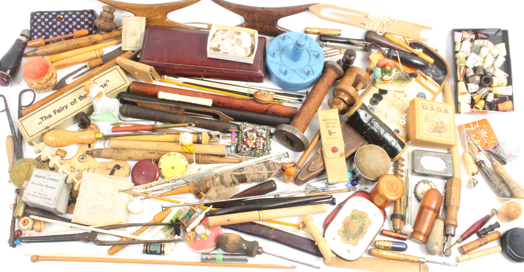 A large mixed lot – sewing – comprising hussifs, large wooden winders, knitting stick cylinders,