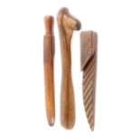 Three wooden knitting sticks all 19th Century comprising a well patinated pine example of natural
