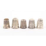 Five English silver thimbles, the first with raised border lettering ‘Polly’, a Blackberry pattern