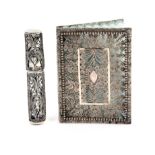 A silver filigree needlebook and a needlecase, the needlebook with elaborate quill work panels,