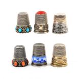 Six continental, mainly German white metal thimbles, comprising two with ‘jewelled’ friezes, another