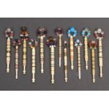 Thirteen 19th Century bone lace bobbins including wire bound dominos and other elaborate examples (