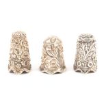 Three Indian Kutch silver thimbles, all with leaf scroll decoration over undulating rims (3) TSL 3/