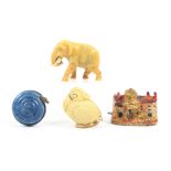 Four novelty tape measures, three in celluloid, comprising a coiled snake, a toucan type bird,