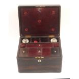 A coromandel wood dressing box of rectangular form, mother of pearl escutcheon and lid plaque, the