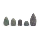 Five early excavated thimbles comprising three bronze Hispano-Moresque examples, 12th – 15th Century