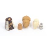 Three thimble cases, comprising an example in ivory and tortoiseshell of octagonal tapering form,