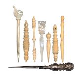 Eight stilettos comprising three turned and carved ivory reversible examples, two turned ivory