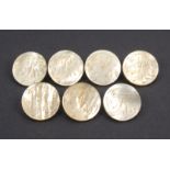 A set of seven early 19th Century mother of pearl circular buttons each engraved with the letter ‘