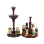 Two 19th Century mahogany reel stands comprising a circular base example with four reel spikes below