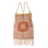 An early 20th Century Lady’s beadwork dress bag, each side in fine coloured beadwork in the
