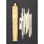 A 19th Century Chinese carved bone netting cylinder of tapering cylinder form carved with dragon and