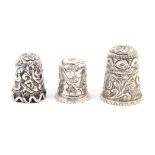 Three Indian Kutch silver thimbles, the first of typical form with undulating rim, the second with