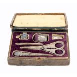 A leather cased rectangular sewing box, circa 1830, with a full complement of silver fittings, the
