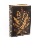 A Fern ware book, the brown covers with fern frond silhouettes, tooled leather spine, The Poetical