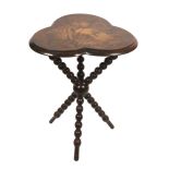 A scarce Fern ware gipsy table, the clover leaf top with silhouette ferns on a brown ground, on