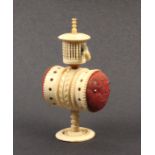 A combination bone pin cushion/tape measure the pedestal double ended pin cushion below a birdcage