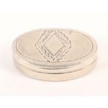 A Georgian oval silver vinaigrette, the lid with vacant diamond cartouche within leaves, internal
