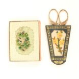 A pincushion book and a scissor case, the pincushion book with a petit point canvas panel of flowers