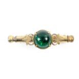 A brass nanny brooch, green glass dome in leaf mount, stamped ‘DXRGM 26803’, 4.5cm