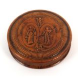 A 19th Century French pressed burr circular snuff box the figural lid inscribed ‘Fideite/Amour/