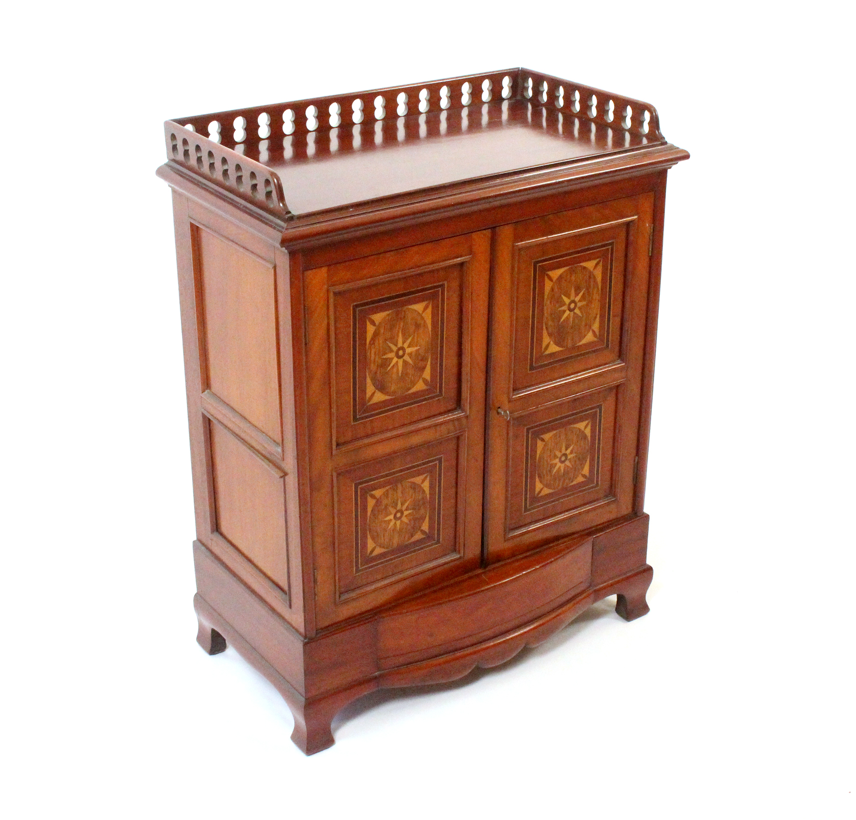 A late Victorian mahogany side cabinet, the rectangular top with a pierced three quarter gallery