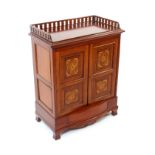A late Victorian mahogany side cabinet, the rectangular top with a pierced three quarter gallery