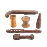 Six pieces of 19th Century treen comprising a hinged beech wood box in the form of a pistol, three