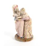 A 19th Century Meissen style figure group, probably French, of two women embracing, pseudo crossed