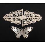 Two silver buckles comprising a lady two-piece example pierced and engraved as a butterfly,