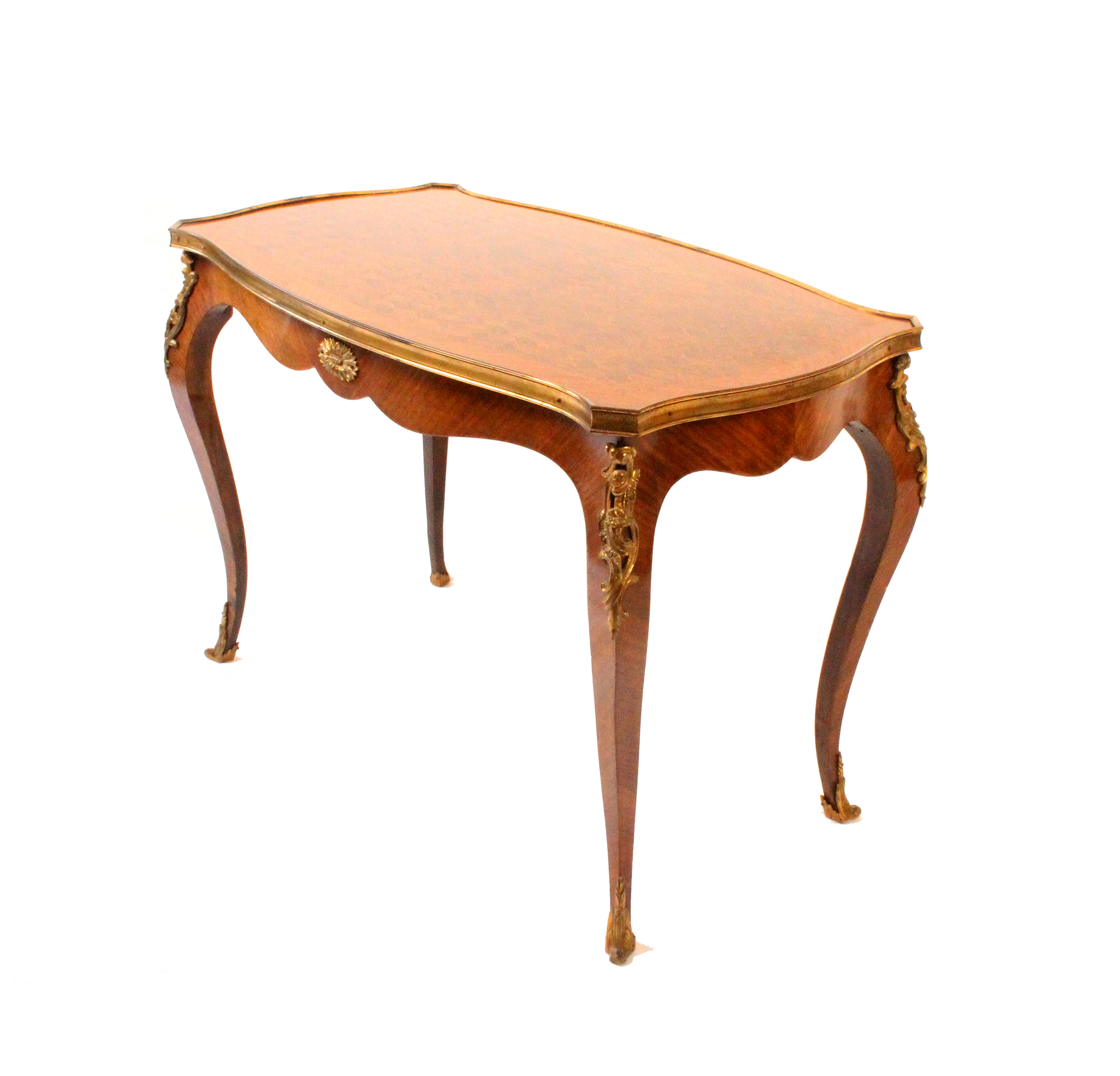 A Louis XVI style occasional table, the rectangular top of serpentine outline, the gilt border