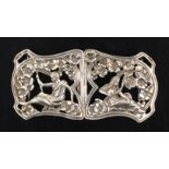 An Art Nouveau style lady’s two-piece silver buckle each part pierced with a seated figure below