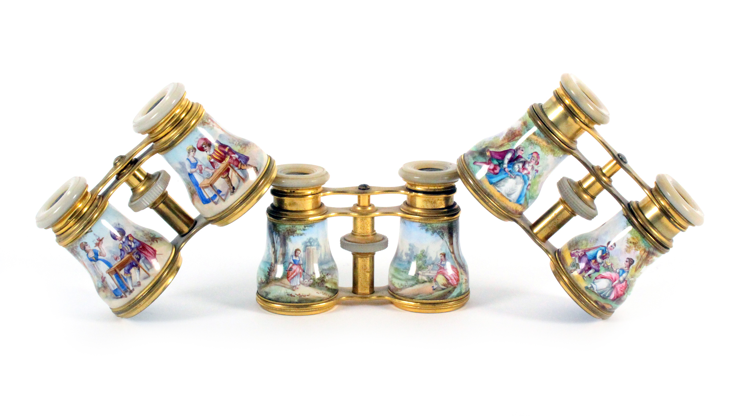 Three pairs of 19th Century enamel decorated opera glasses, all with mother of pearl eye rims and