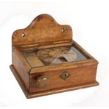 John Gamgee’s Patent Stamp Dispenser – the glazed top oak case with shaped wall mount, the bevel