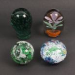 Four 19th Century and 20th Century paperweights comprising a flower in plant pot example, label to