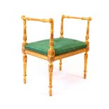 A French 19th Century George III giltwood dressing stool, the rectangular upholstered top flanked by
