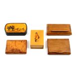 Four snuff boxes and another box comprising a papier machè rounded end rectangular example the lid