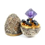 A Stuart Devlin silver and silver gilt surprise egg, the egg with lattice work overlay, the gilded