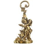 A brass door stop, cast as Cupid amid vine leaves, 49cm high